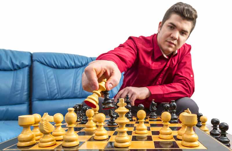 Guy playing chess alone